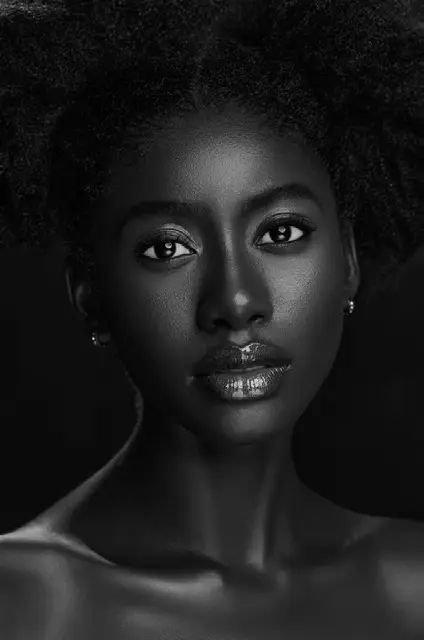 Black and white portrait of a woman with a direct, composed gaze